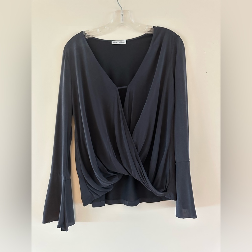 Bell sleeve, wrapped front top. Excellent condition.